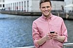 Casual Pose Of Smiling Man At Outdoors Stock Photo