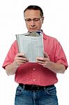 Casual Senior Man Reading A Book Stock Photo