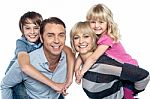 Caucasian Family Of Four In The Studio Stock Photo