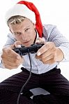 Caucasian Man With Remote And Christmas Hat Stock Photo