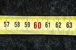 Centimeters Near A Tape Measure On The Number Sixty Stock Photo