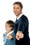 Charming Father And Son Pointing At You Stock Photo