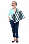 Charming Senior Lady With Shopping Bag Stock Photo