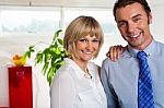 Cheerful Business Couple In Their New Office Stock Photo