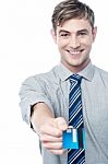 Cheerful Businessman Giving His Credit Card Stock Photo