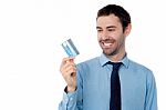 Cheerful Businessman Holding Credit Card Stock Photo