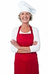 Cheerful Confident Aged Female Chef Stock Photo