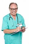 Cheerful Doctor Gathering Information From Patient Stock Photo