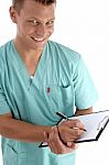 Cheerful Doctor Writing A Prescription Stock Photo