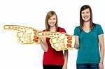 Cheerful Fans Pointing The Big Foam Hand Sideways Stock Photo