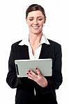 Cheerful Female Manager Using Touch Pad Stock Photo