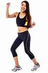 Cheerful Fitness Trainer Dancing In Joy Stock Photo