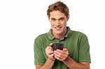 Cheerful Guy Enjoying Hot Beverage Stock Photo