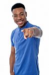 Cheerful Guy Pointing Towards Camera Stock Photo