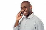 Cheerful Guy Using  His Mobile Phone Stock Photo