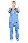 Cheerful Lady Doctor Showing Double Thumbs Up Stock Photo