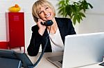 Cheerful Lady Engaged In A Jovial Conversation Stock Photo