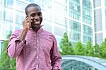 Cheerful Man Communicating Via Phone Stock Photo