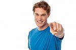 Cheerful Man Pointing Towards Camera Stock Photo