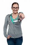 Cheerful Medical Practitioner Pointing At The Camera Stock Photo