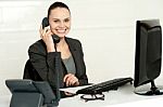 Cheerful Secretary Advising Her Client Stock Photo