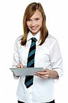 Cheerful Student In School Attire Using Tablet Pc Stock Photo