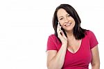 Cheerful Woman Talking On The Phone Stock Photo