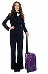 Cheerful Woman Traveler Holding Trendy Purple Strolley Stock Photo