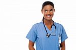 Cheerful Young Doctor Is Looking Away Stock Photo