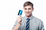 Cheerful Young Executive Holding Credit Card Stock Photo