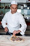 Chef Busy In Preparing Pizza Stock Photo