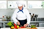 Chef Carefully Chopping Vegetables Stock Photo