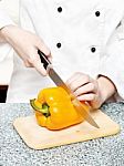 Chef Cutting Bell Peppers Stock Photo