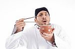 Chef Holding Bowl And Chopstick Stock Photo