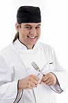 Chef Holding Fork And Knife Stock Photo