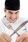 Chef Holding Fork And Knife Stock Photo