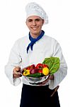 Chef Holding Fresh Vegetables In Strainer Bowl Stock Photo