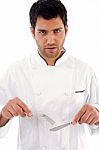 Chef Holding Knife And Fork Stock Photo