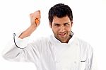 Chef Holding Knife Threateningly Stock Photo