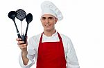 Chef Showing Kitchen Essentials Stock Photo