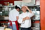 Chef Throwing The Pizza Base Dough Stock Photo