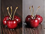 Cherries On Wooden Table With Water Drops Stock Photo