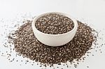 Chia Seeds In White Bowl On White Stock Photo