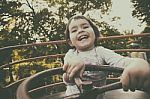 Child In Ferris Wheel Stock Photo