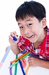 Child Show His Works From Clay, Over White. Strengthen The Imagi Stock Photo