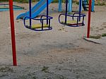 Children Playground, Swing Near The House  Stock Photo