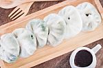 Chinese Leek Steamed Dessert On Wooden Table Stock Photo