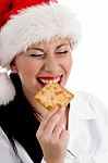 Christmas Woman Eating Biscuit Stock Photo