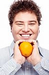 Chubby Boy And Orange Stock Photo