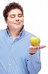 Chubby Man Holding Apple Stock Photo